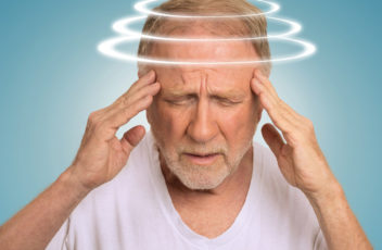 Headshot senior man with vertigo suffering from dizziness