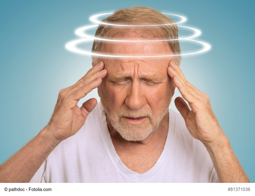 Headshot senior man with vertigo. Elderly male patient suffering from dizziness isolated on light blue background